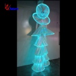 White face man on stilt light costume on parade